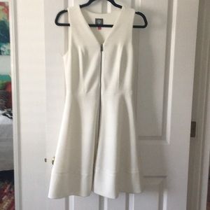 Zip front , cream, lined, fitted, poly/spandex